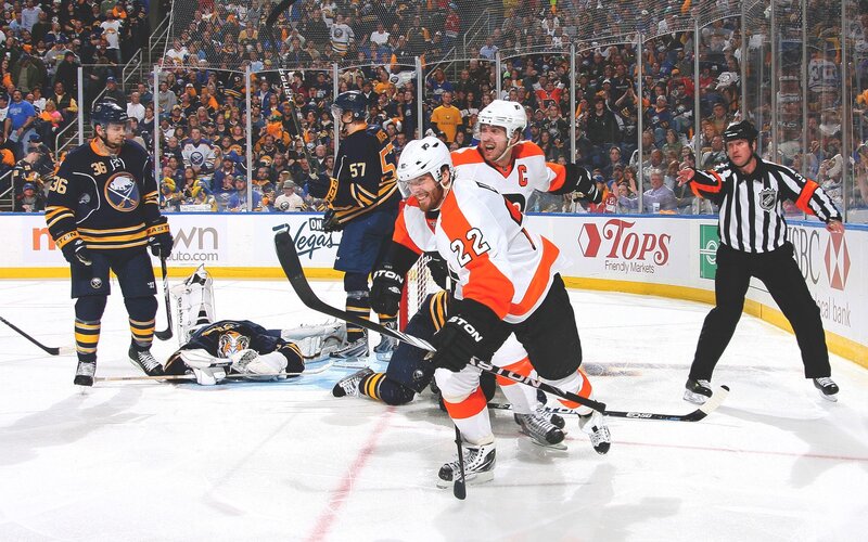 Hockey players celebrate goal
