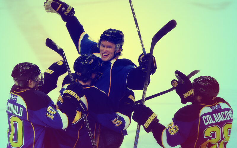 Hockey players celebrate on ice