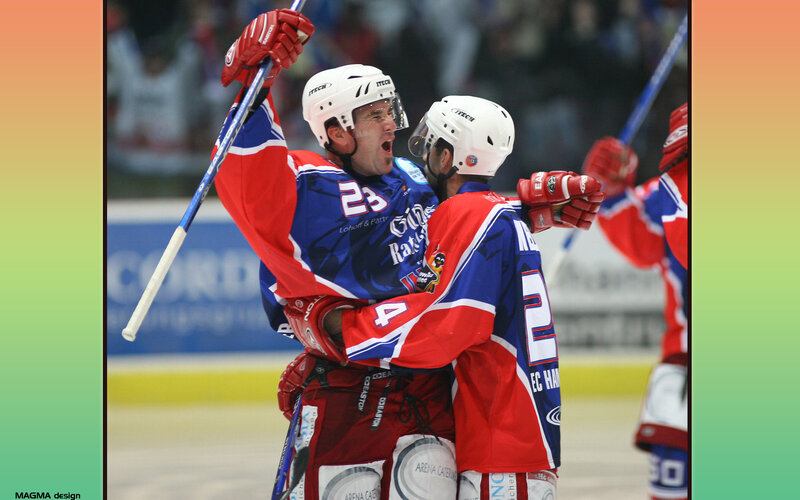 Hockey players celebrating goal