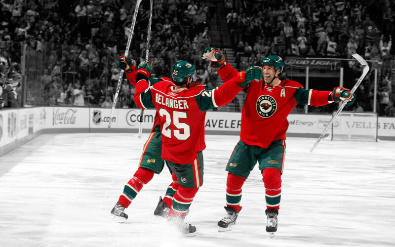 Hockey players celebrating on ice