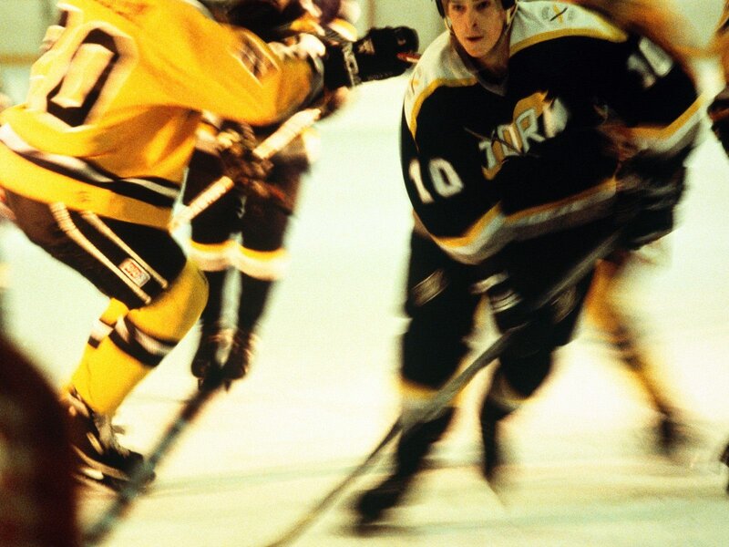 Hockey players in action on ice