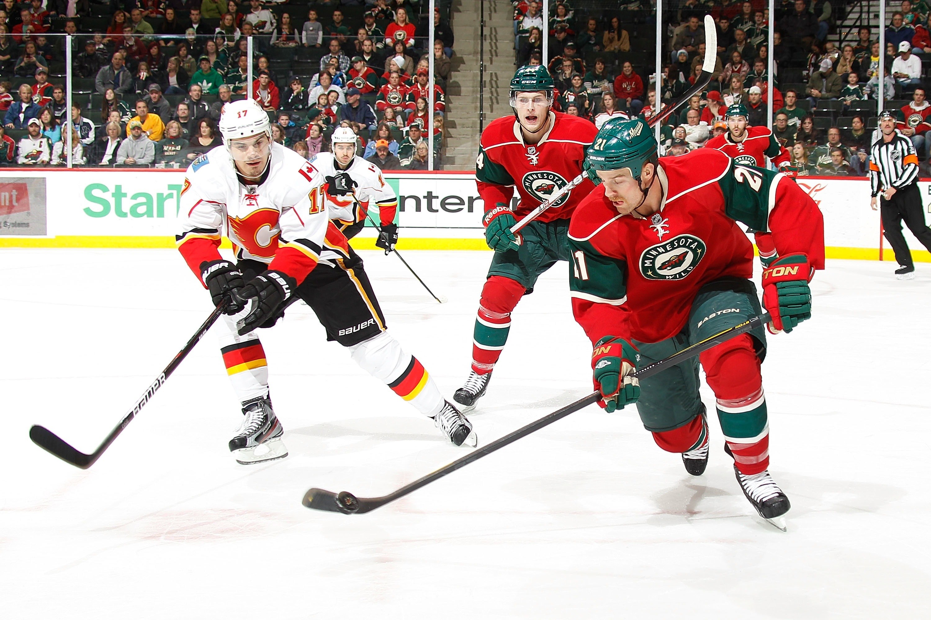 Hockey players in action on ice