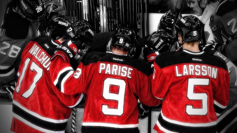 hockey players in red jerseys