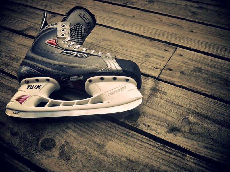 hockey skate on wooden deck