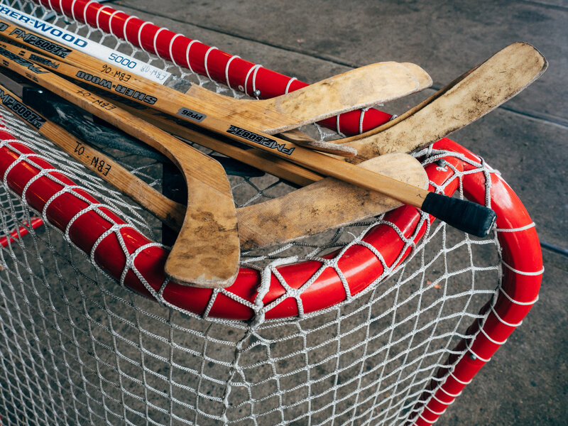 hockey sticks in a net