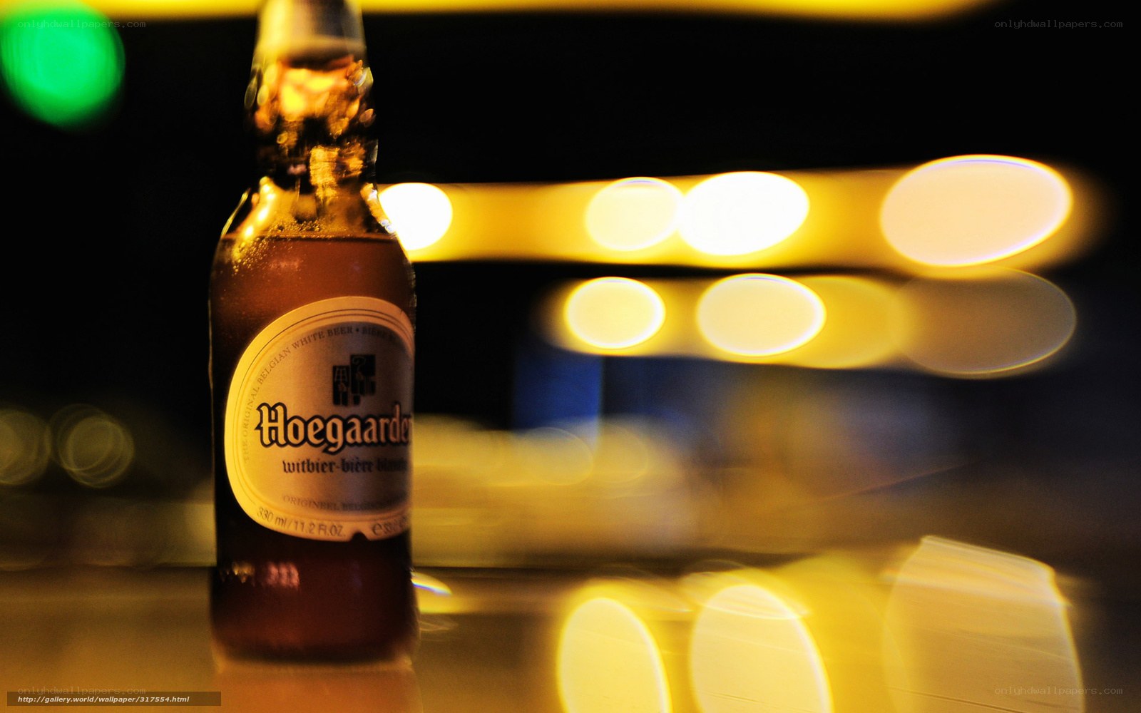 Hoegaarden beer bottle at night