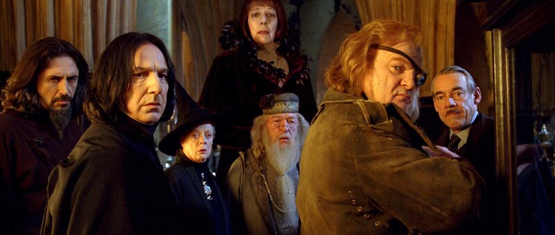 Hogwarts staff in a tense meeting