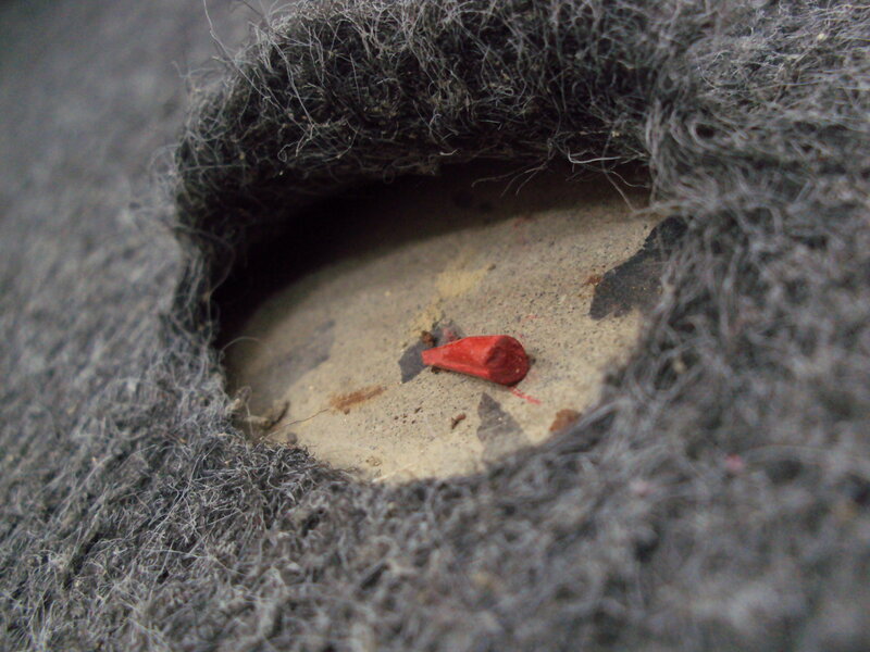 Hole in Gray Fabric