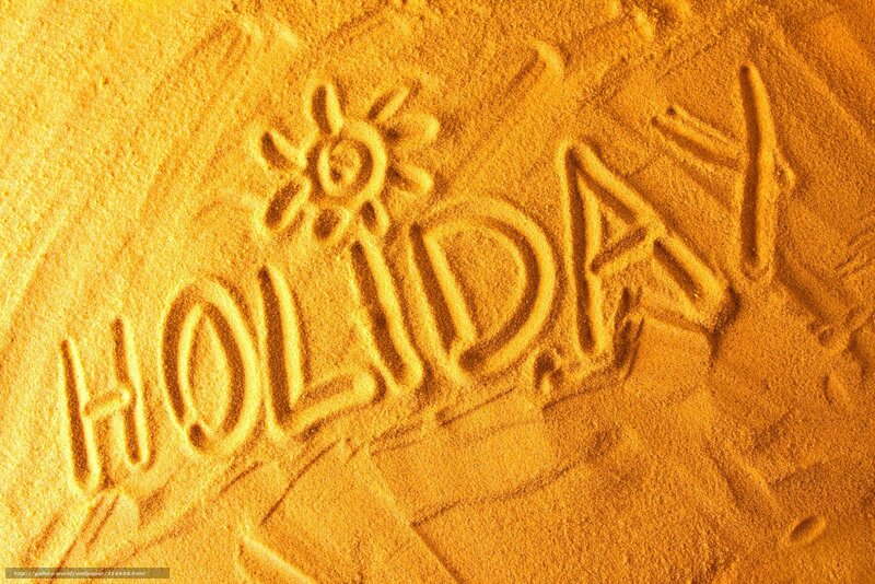 Holiday written in sand