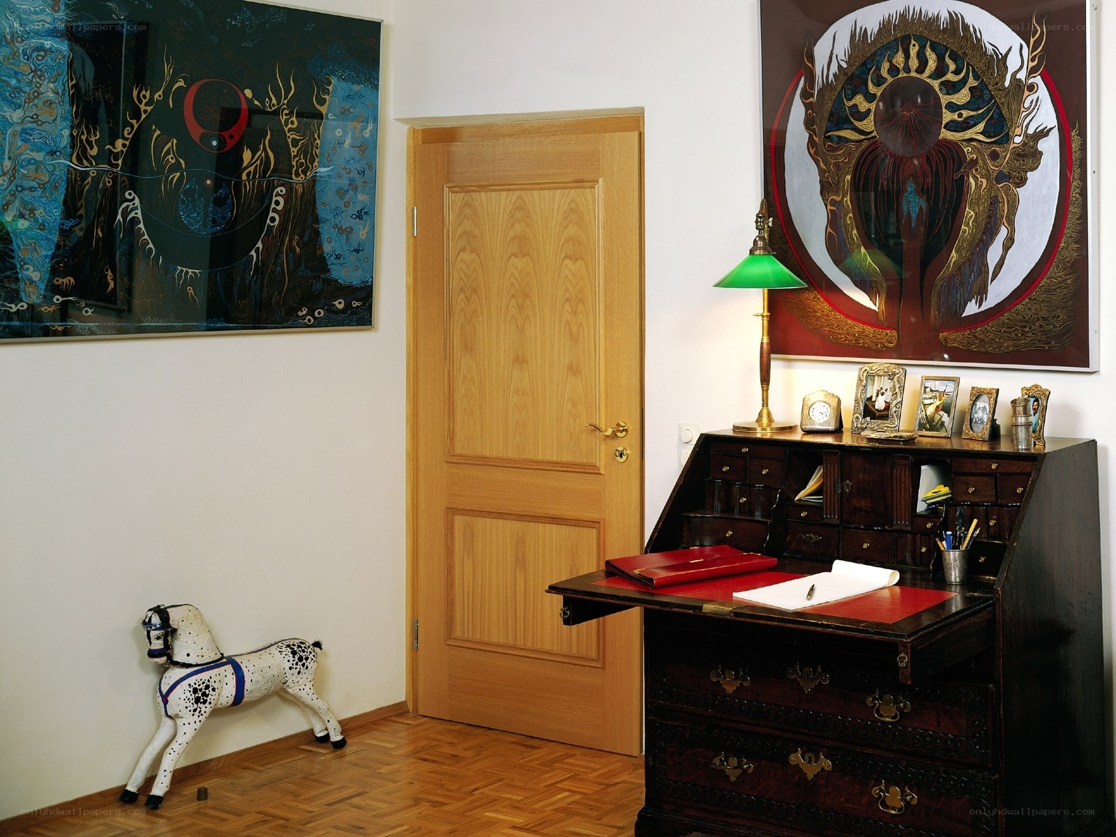 Home office with art and desk