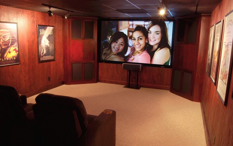 home theater room with movie posters