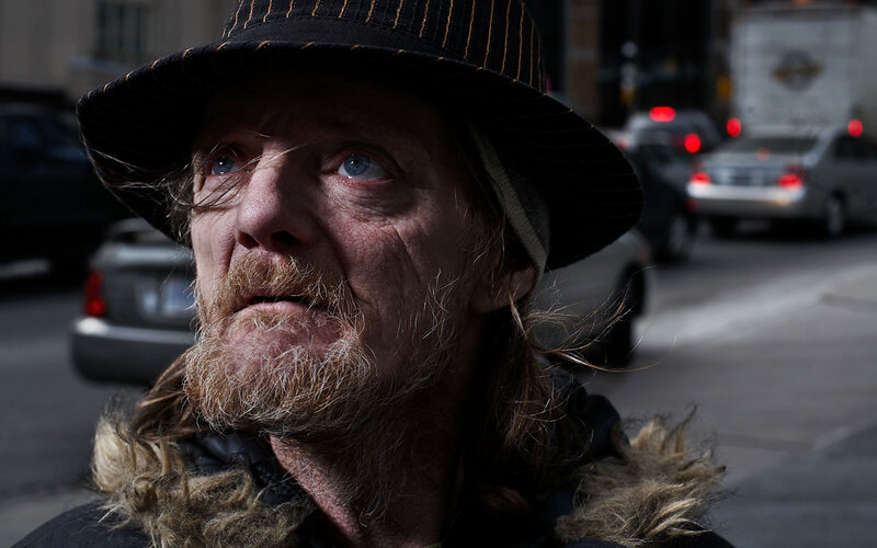 Homeless man on city street