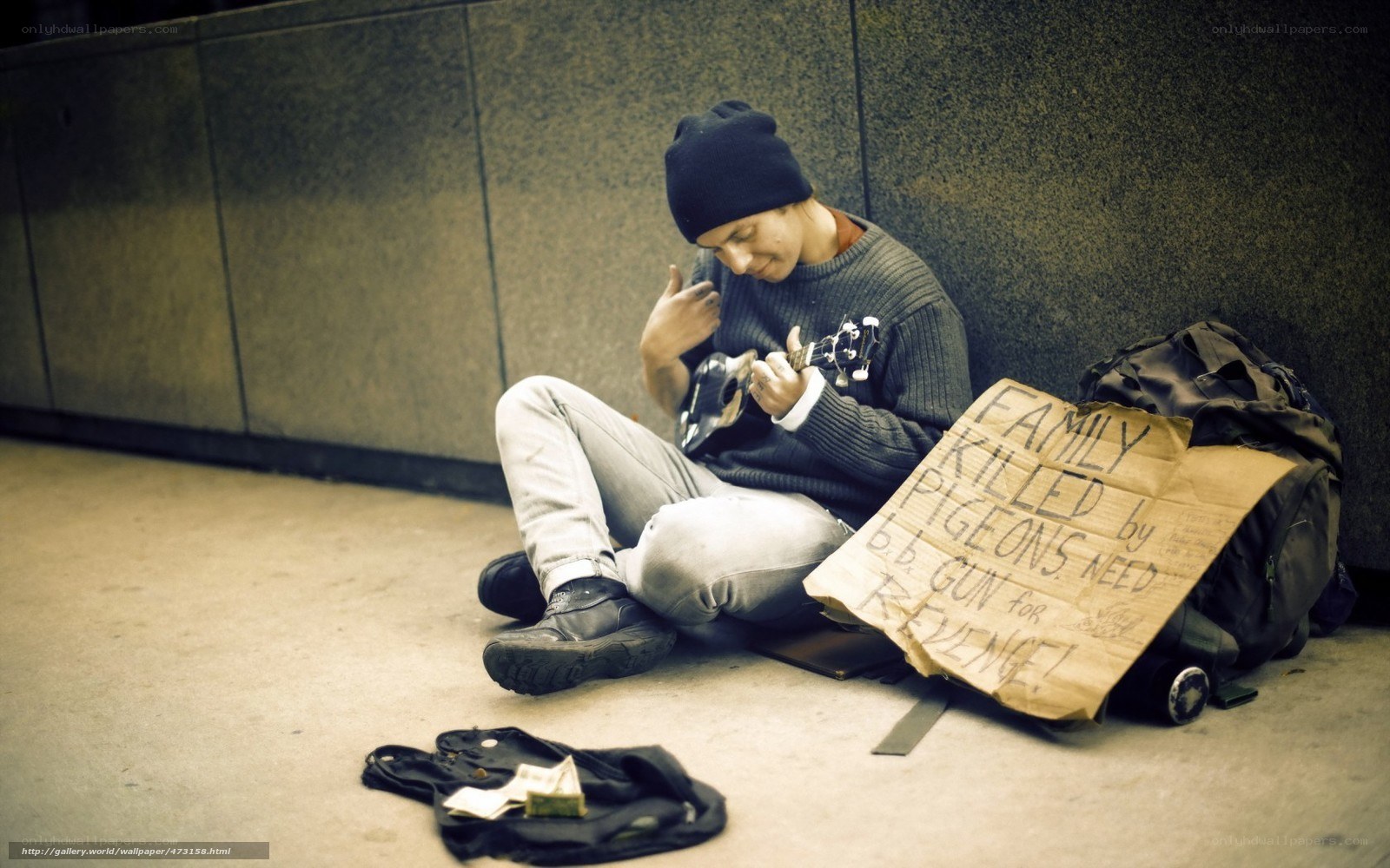 Homeless man playing ukulele