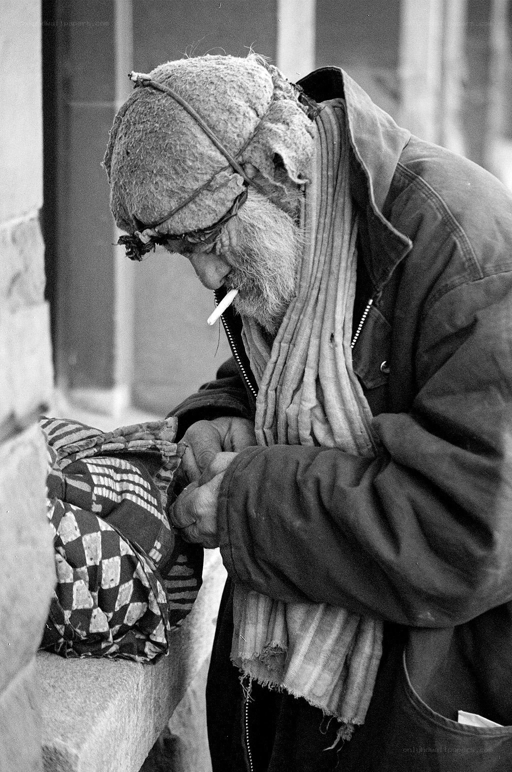 homeless man smoking a cigarette