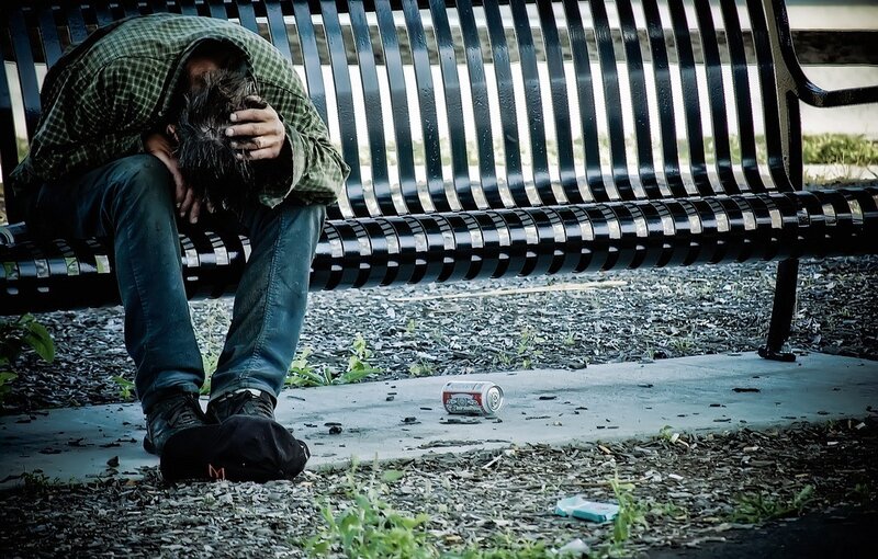 Homeless person on a bench
