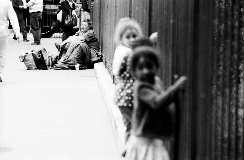 Homeless woman on sidewalk