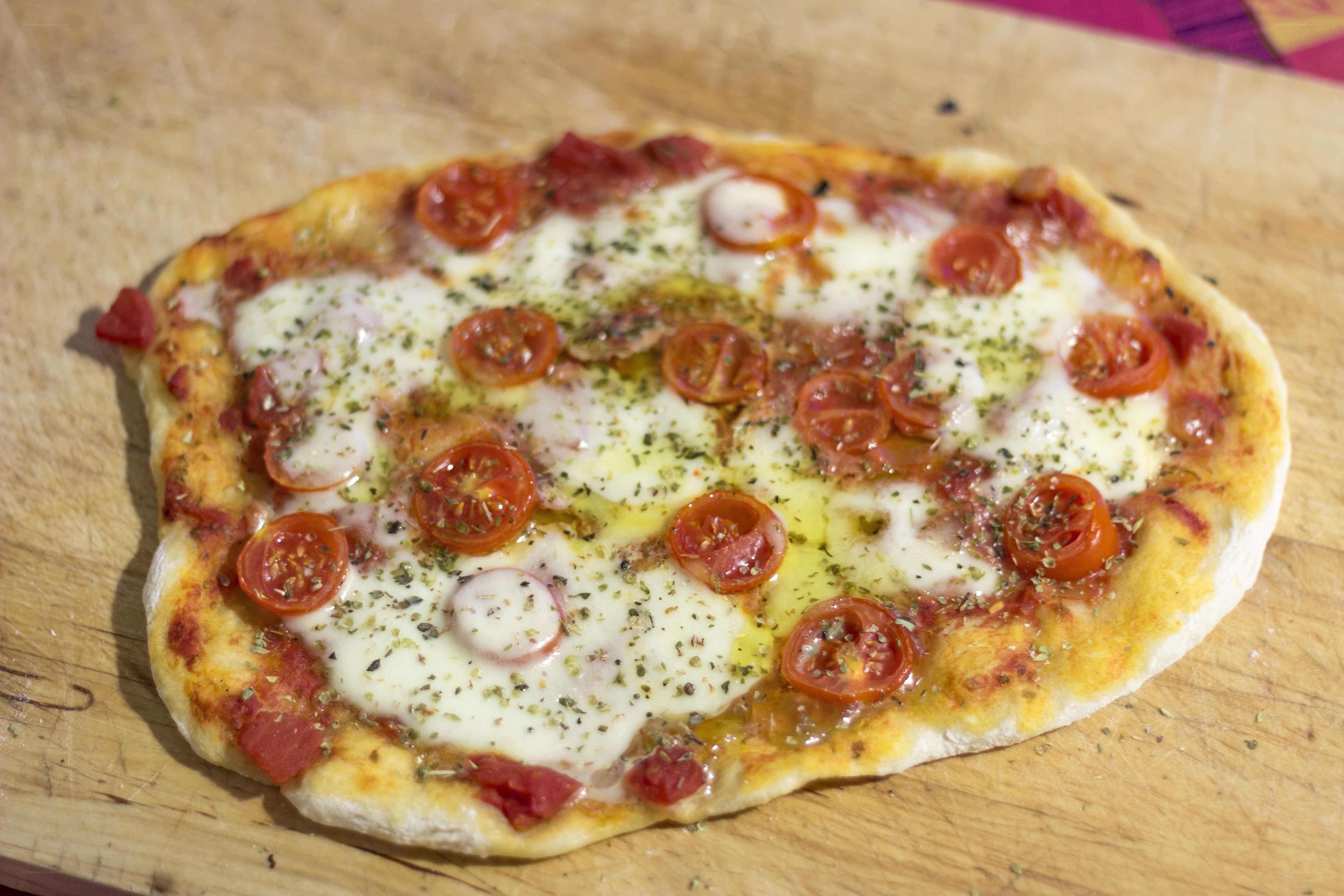 Homemade pizza with tomatoes