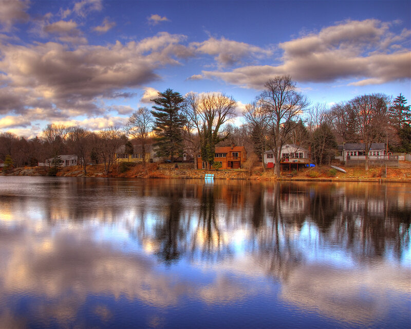 Homes on a lake at sunset