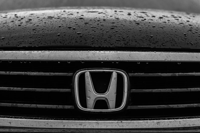 Honda emblem on wet car