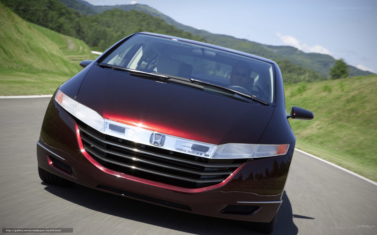 Honda minivan on a scenic road