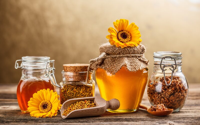 Honey and bee products on wood