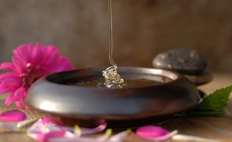 honey being poured into a bowl