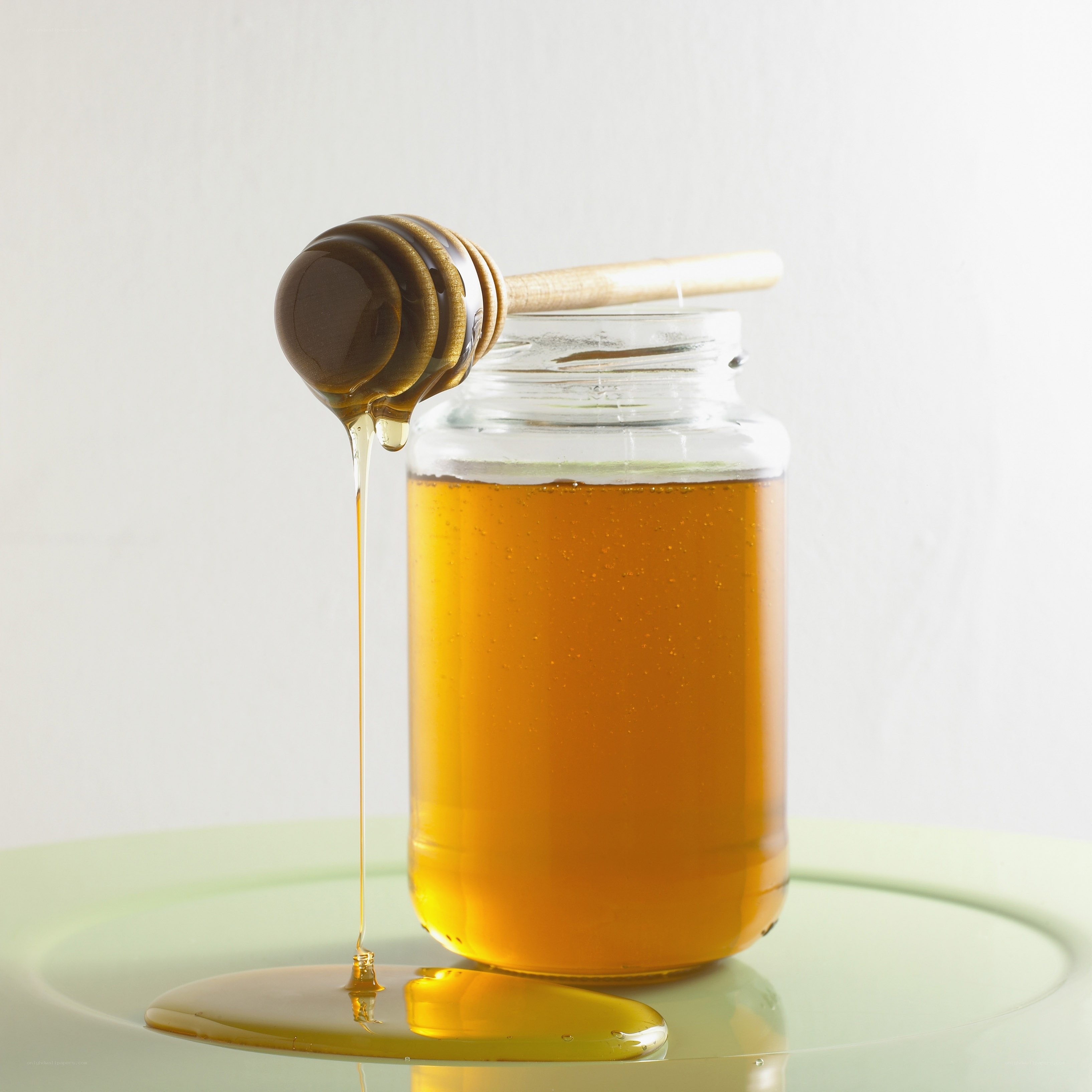 honey dripping from a dipper