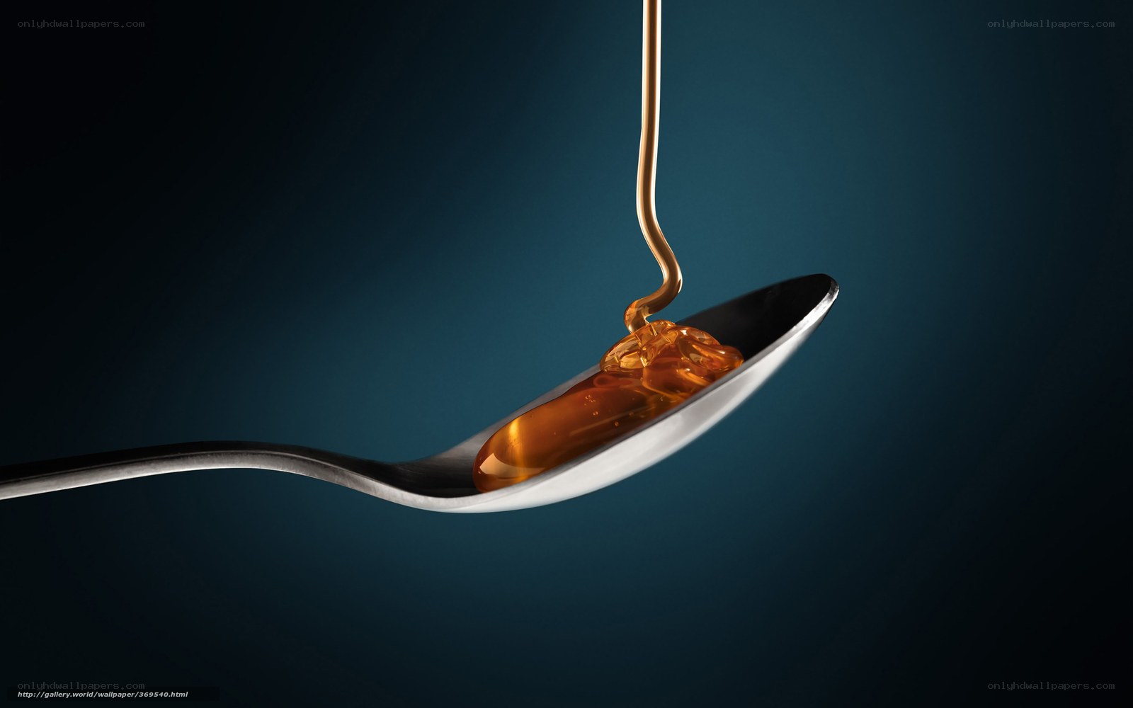 honey dripping on spoon