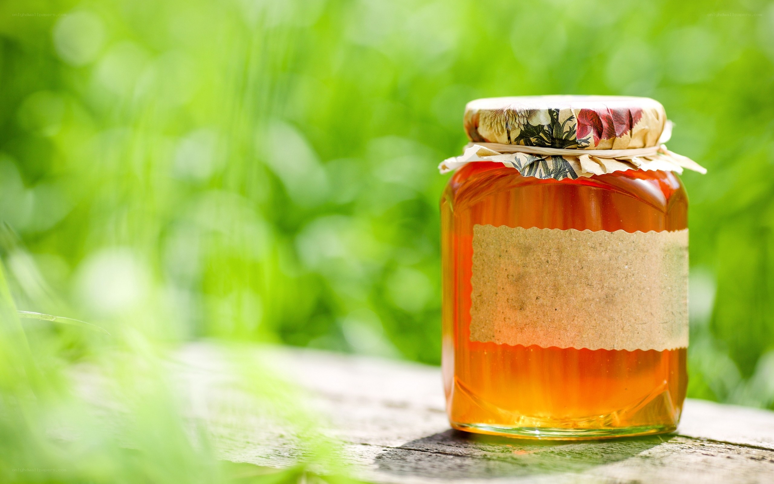 honey jar on wooden surface