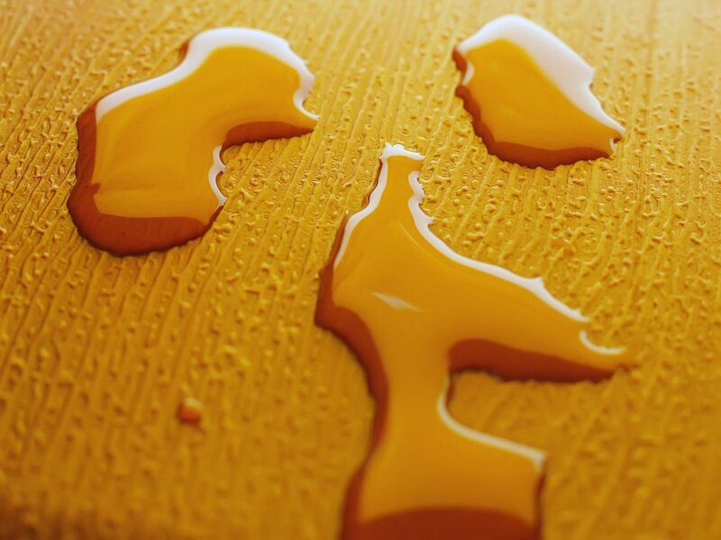 honey on wooden surface