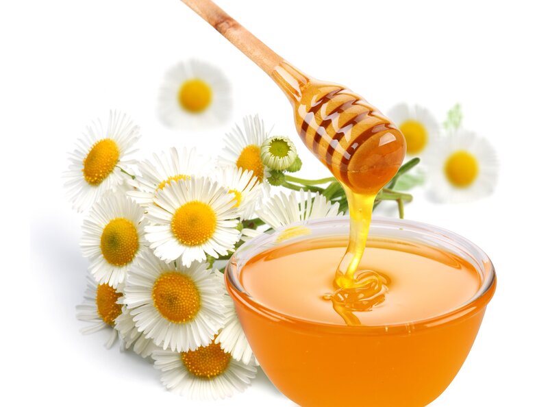 honey with chamomile flowers