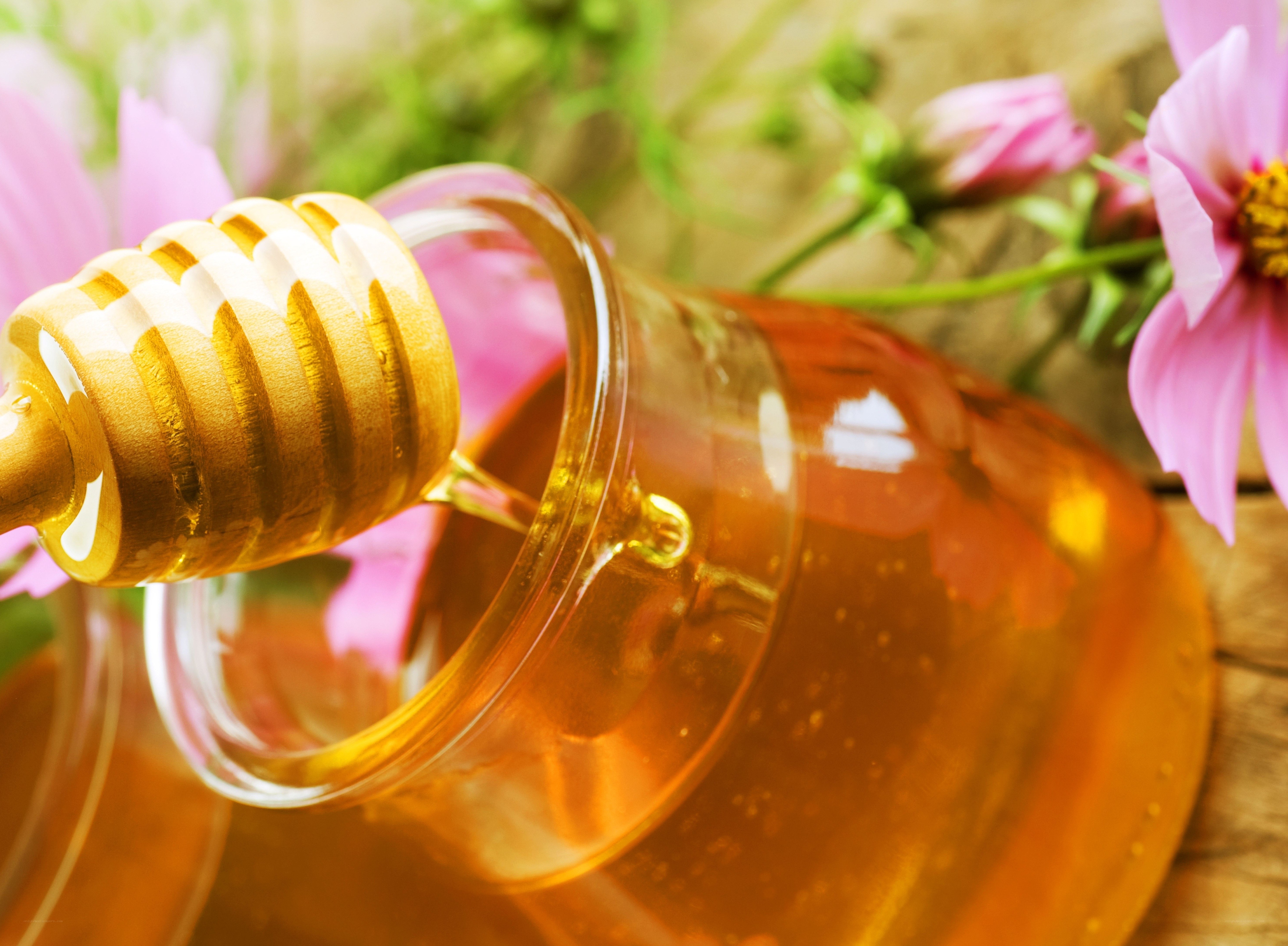 honey with dipper and flowers