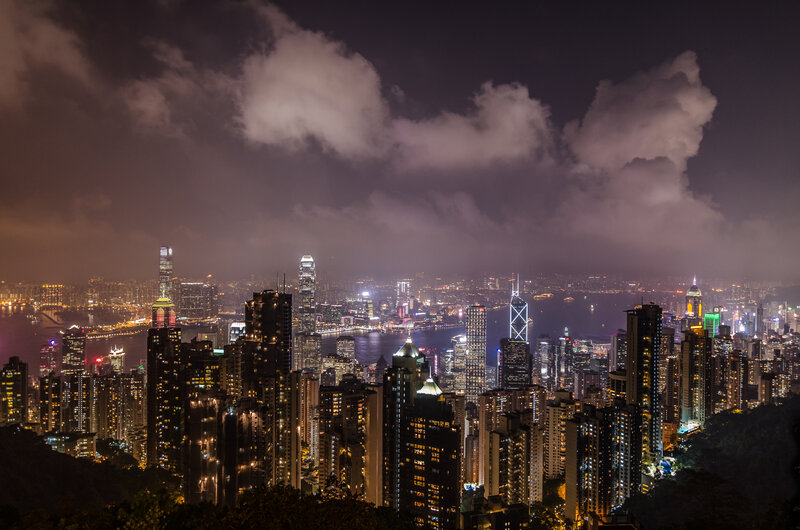 Hong Kong Skyline at Night — Black, Dramatic, Photograph, Skyscrapers, Bay, Clouds