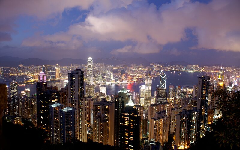 Hong Kong Skyline at Night — Blue, Dramatic, Photograph, Skyscrapers, Harbor, Mountains, Clouds, Purple, Yellow