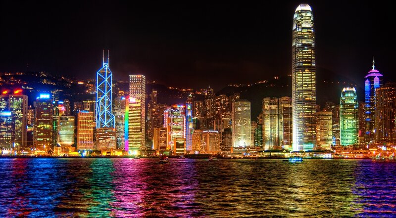 Hong Kong Skyline at Night — Blue, Dramatic, Photograph, Skyscrapers, Water, Boats, Mountains