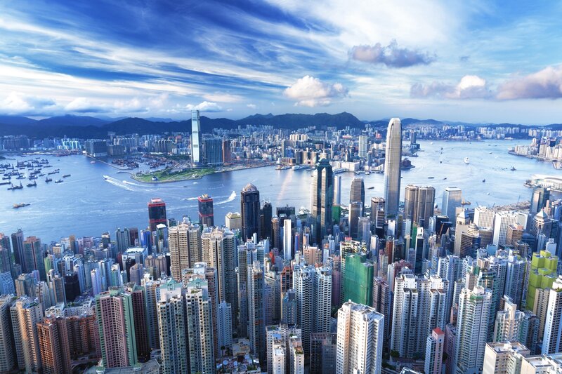 Hong Kong Skyline — Blue, Dramatic, Afternoon, Photograph, Skyscrapers, Harbor, Mountains