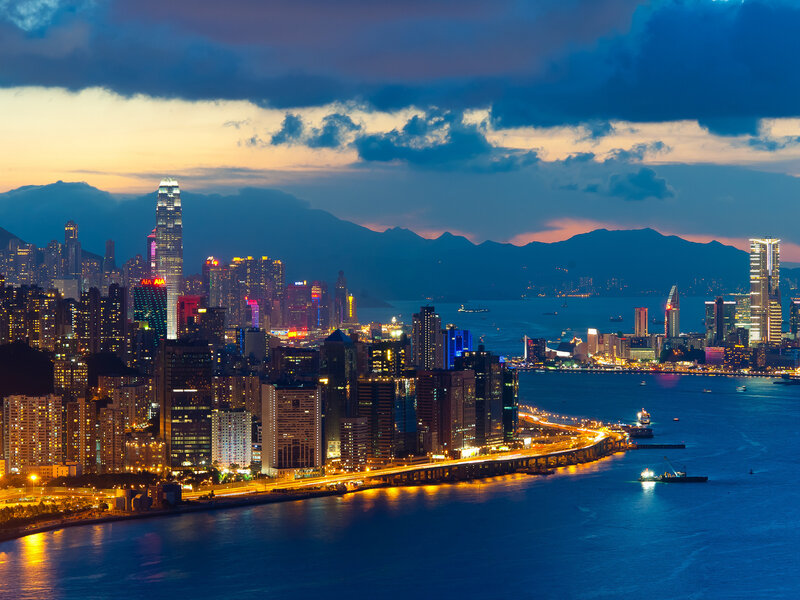 Hong Kong Skyline — Blue, Dramatic, Night, Photograph, Skyscrapers, Mountains, Bay