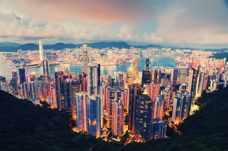 Hong Kong Skyline — Blue, Dramatic, Sunset, Photograph, Skyscrapers, Harbor, Mountains, Trees, Orange