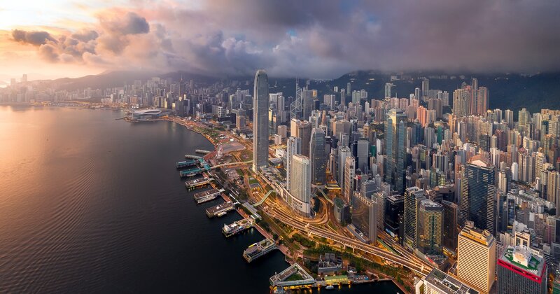 Hong Kong Skyline — Orange, Dramatic, Sunset, Photograph, Skyscrapers, Harbor, Mountains
