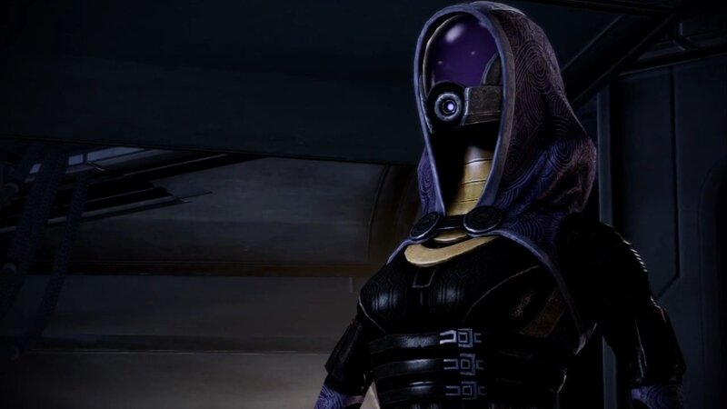 hooded character in dark setting