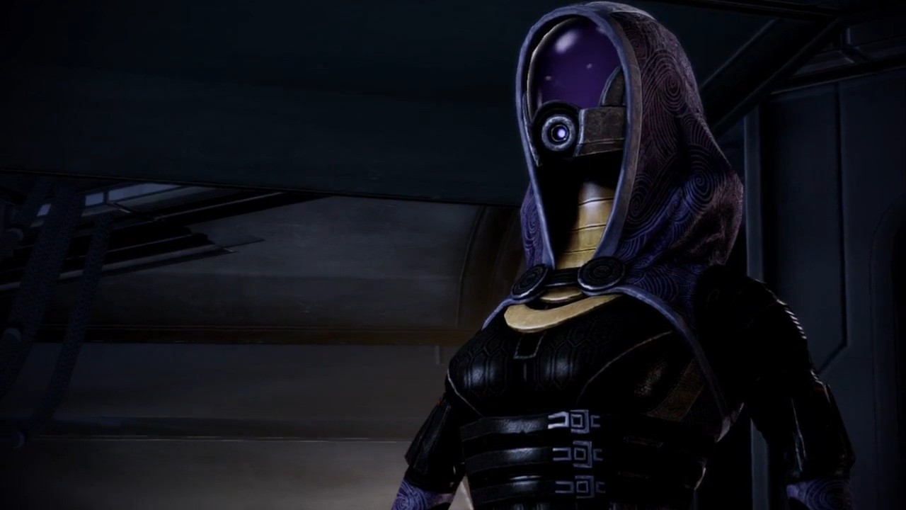 hooded character in dark setting