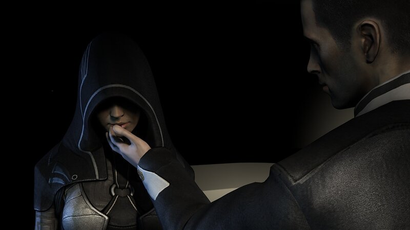 hooded figure and man in dark room