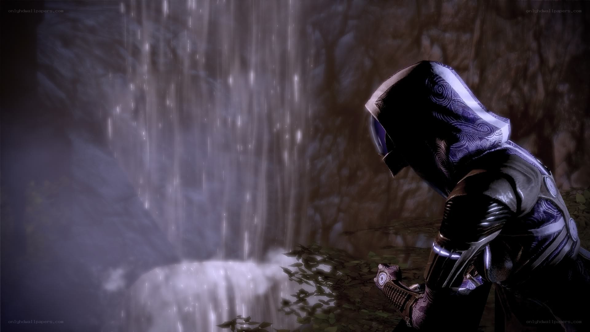 hooded figure at waterfall