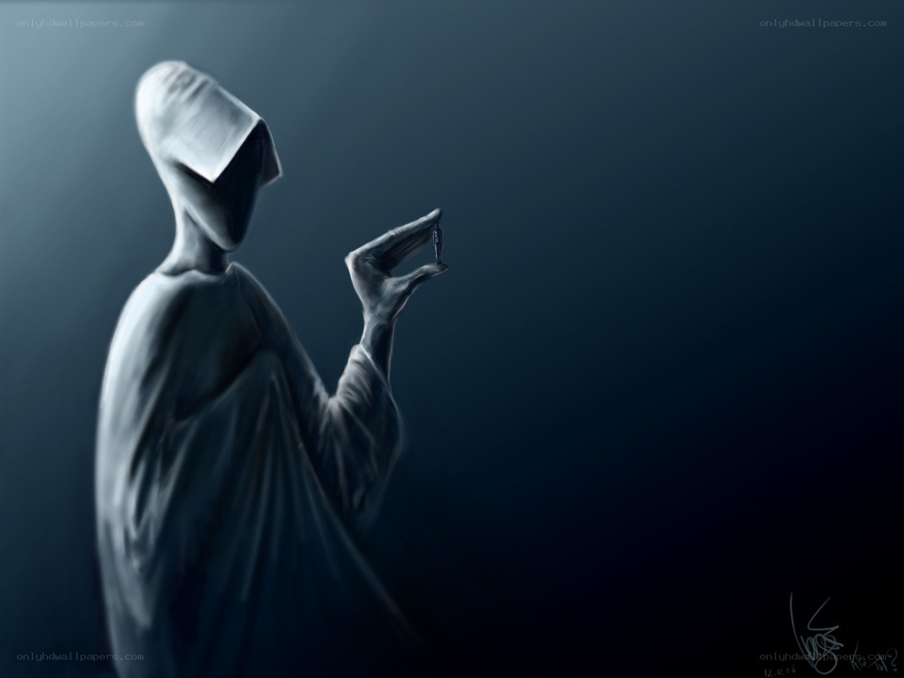hooded figure holding small object