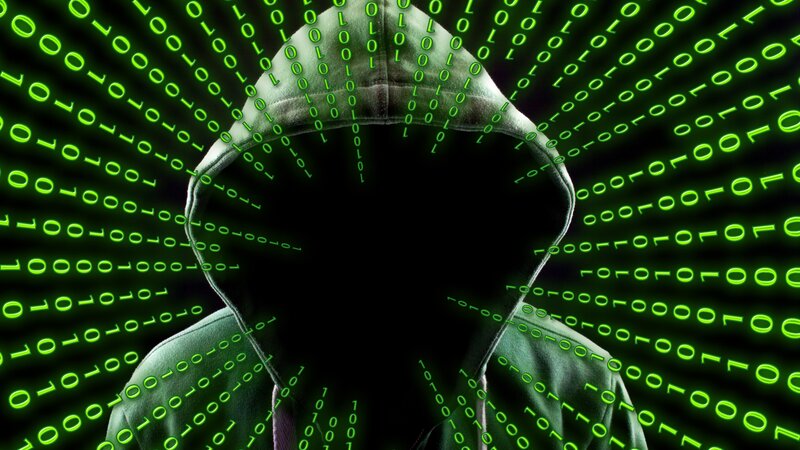 Hooded Figure in Binary Code