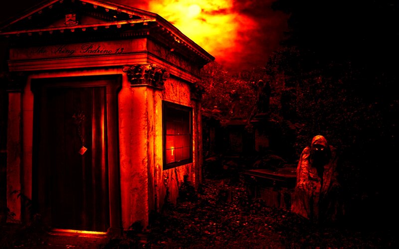 Hooded Figure in Cemetery