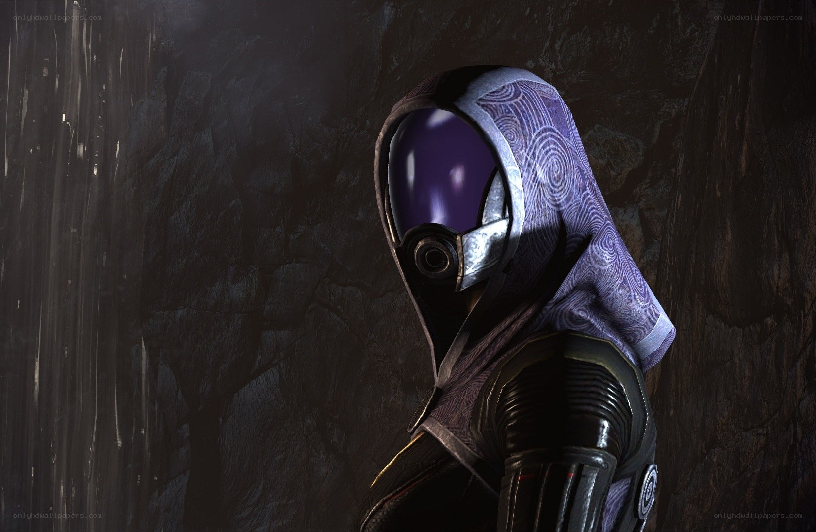 hooded figure in dark cave