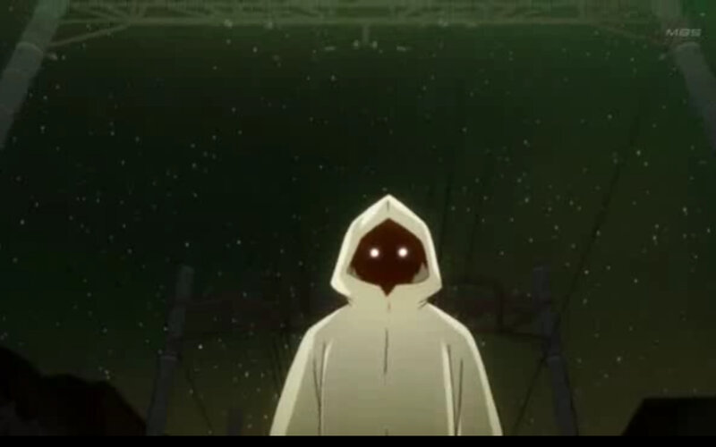hooded figure in dark setting