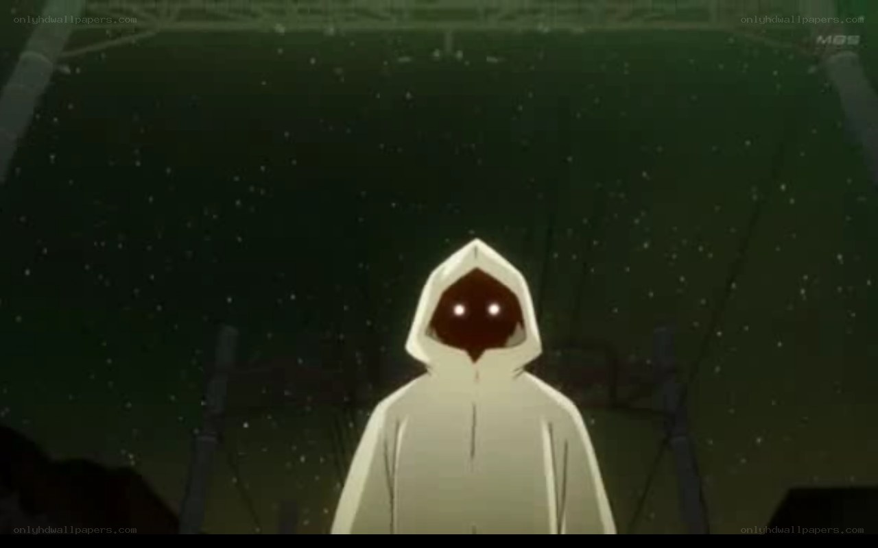 hooded figure in dark setting