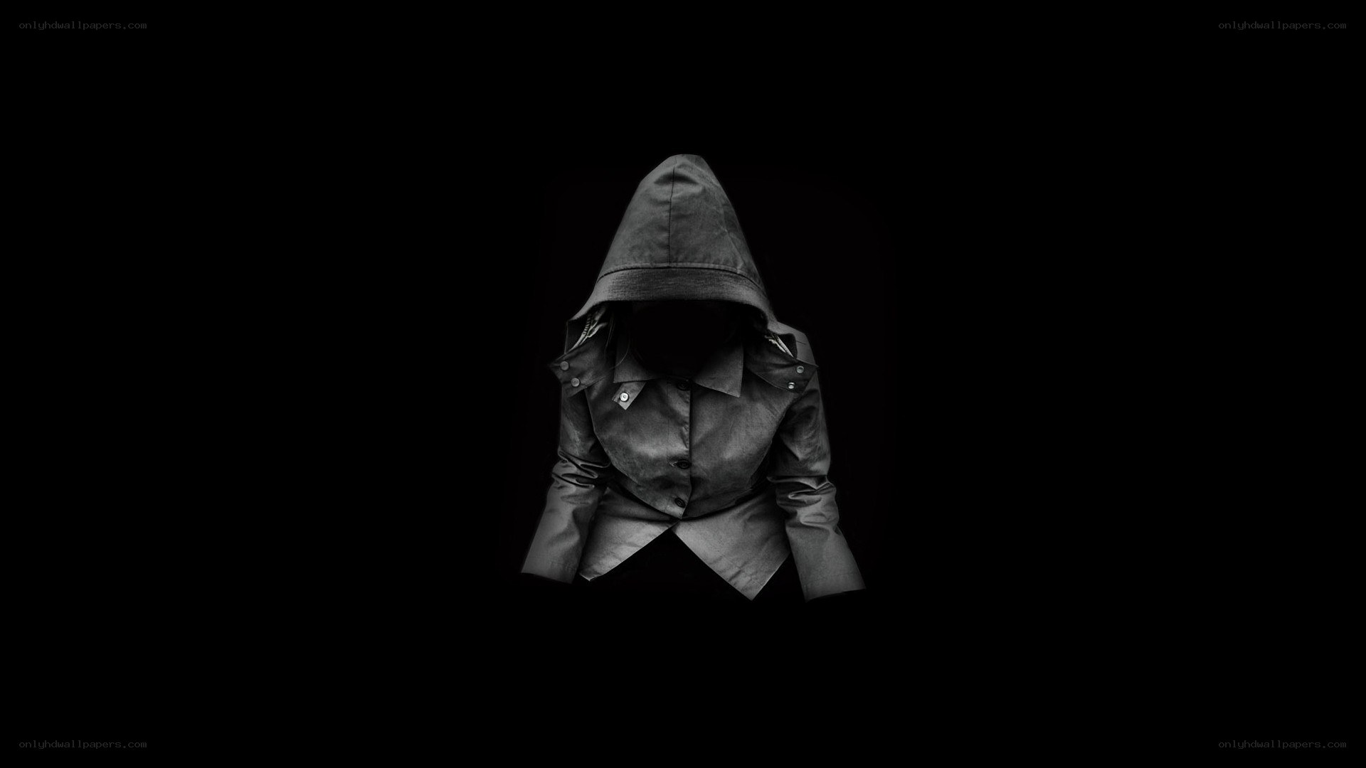 hooded figure in darkness
